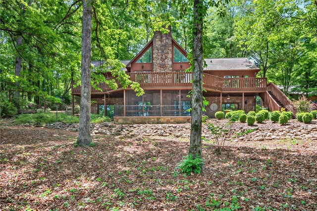 234 Chandlers Ferry Dr, Hartwell, GA 30643 - back of property with a chimney, a wooden deck, a sunroom, and stairs