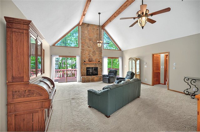234 Chandlers Ferry Dr, Hartwell, GA 30643 - living area with a stone fireplace, a ceiling fan, light carpet, baseboards, and high vaulted ceiling