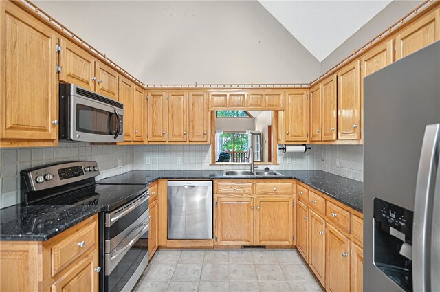 234 Chandlers Ferry Dr, Hartwell, GA 30643 - kitchen featuring a sink, light tile patterned flooring, tasteful backsplash, lofted ceiling, and appliances with stainless steel finishes