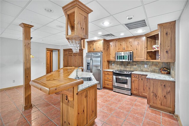 234 Chandlers Ferry Dr, Hartwell, GA 30643 - kitchen with tasteful backsplash, a sink, a drop ceiling, appliances with stainless steel finishes, and visible vents
