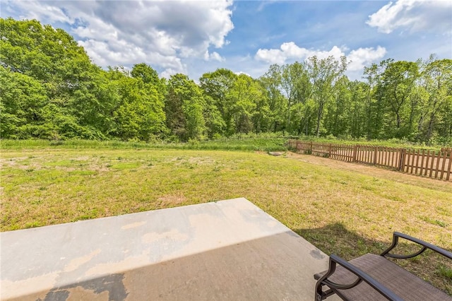 view of yard with fence and a patio area