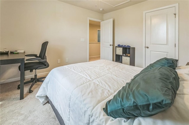carpeted bedroom featuring baseboards