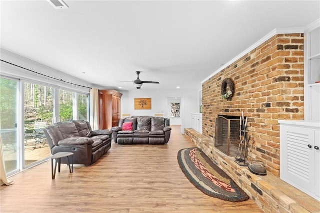 112 Briar Creek Ln, Anderson, SC 29621 - living area with light wood finished floors, a brick fireplace, visible vents, and ceiling fan