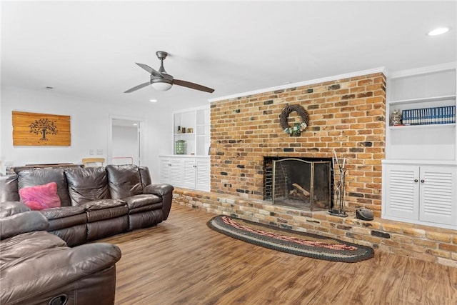 112 Briar Creek Ln, Anderson, SC 29621 - living area with recessed lighting, wood finished floors, a ceiling fan, a brick fireplace, and built in shelves