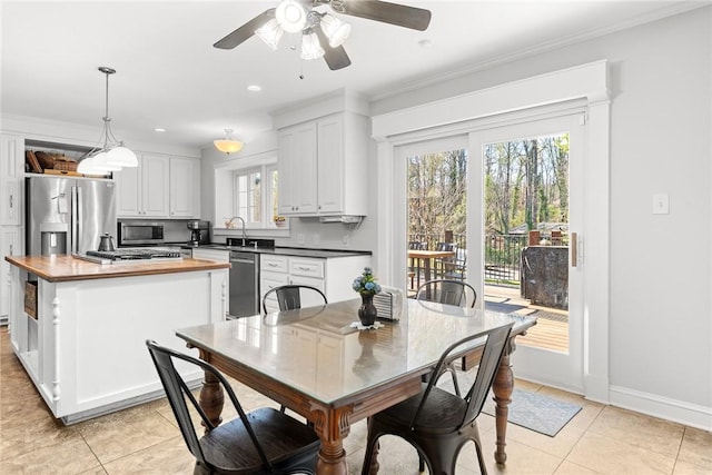 112 Briar Creek Ln, Anderson, SC 29621 - dining room featuring ceiling fan, baseboards, crown molding, and light tile patterned floors