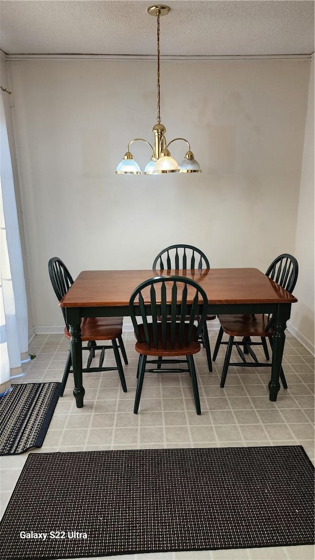 dining area featuring a notable chandelier, a textured ceiling, and light tile patterned flooring