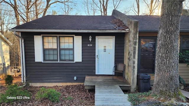view of front of house with a shingled roof