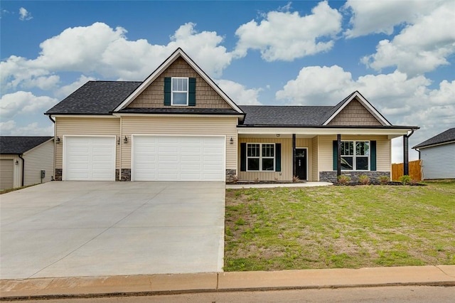 craftsman house featuring stone siding, a front lawn, and covered porch