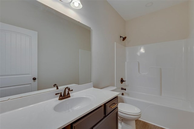 full bathroom featuring toilet, vanity, shower / tub combination, and wood finished floors