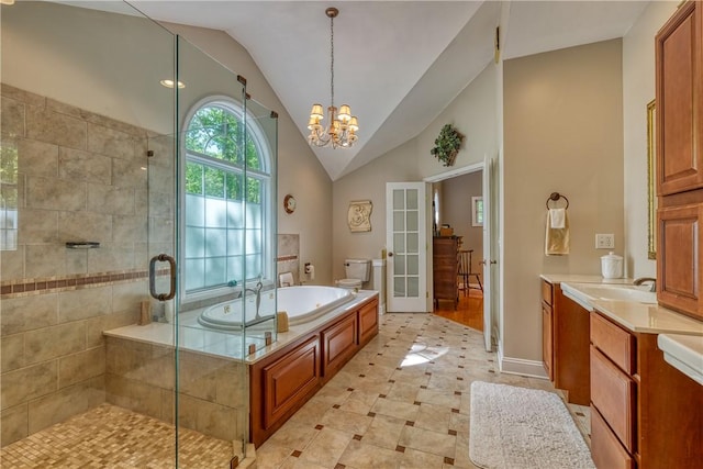 bathroom with lofted ceiling, toilet, vanity, a bath, and a stall shower