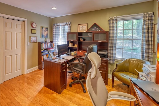 home office with light wood-type flooring, baseboards, and recessed lighting