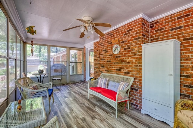 sunroom / solarium with a ceiling fan