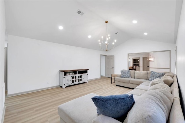 living room with wood finished floors, lofted ceiling, a notable chandelier, visible vents, and recessed lighting