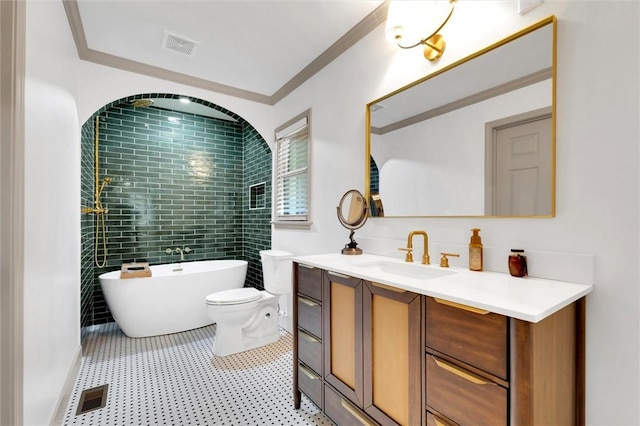 full bathroom featuring a soaking tub, vanity, visible vents, and crown molding