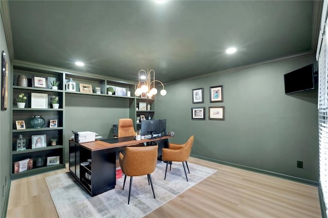 office space with recessed lighting, light wood-style flooring, ornamental molding, and an inviting chandelier