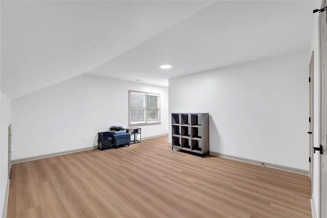 bonus room with recessed lighting, vaulted ceiling, wood finished floors, and baseboards