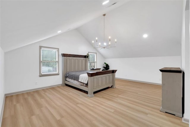 bedroom featuring light wood finished floors, vaulted ceiling, baseboards, and a chandelier