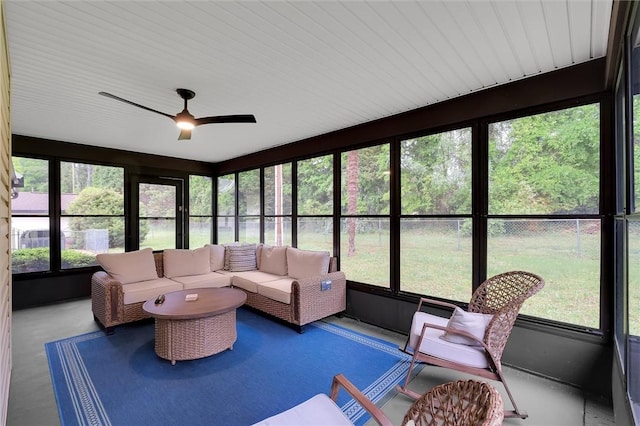 sunroom / solarium with ceiling fan, outdoor lounge area, and a healthy amount of sunlight