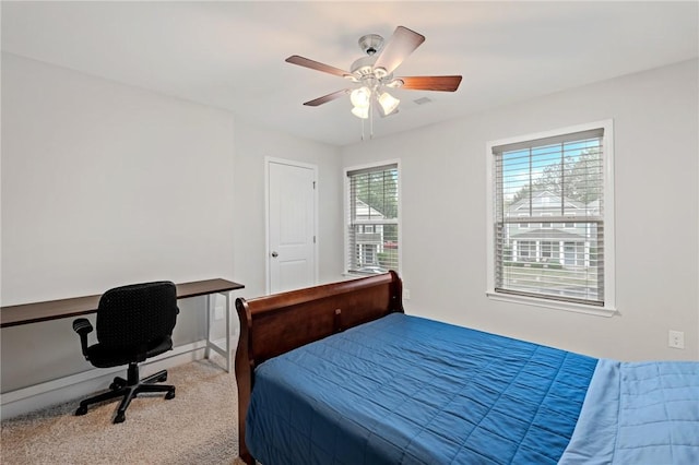 bedroom with light carpet and ceiling fan