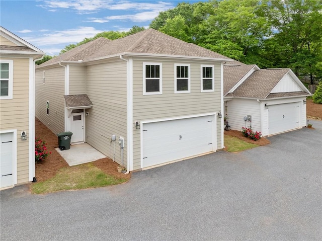 view of front of property featuring roof with shingles