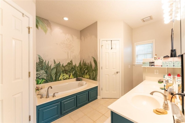 bathroom with a sink, double vanity, visible vents, recessed lighting, and a garden tub