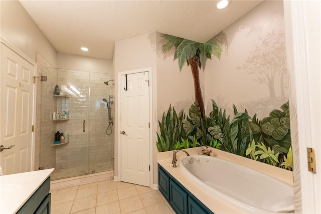bathroom with tile patterned floors, recessed lighting, a shower stall, a garden tub, and vanity