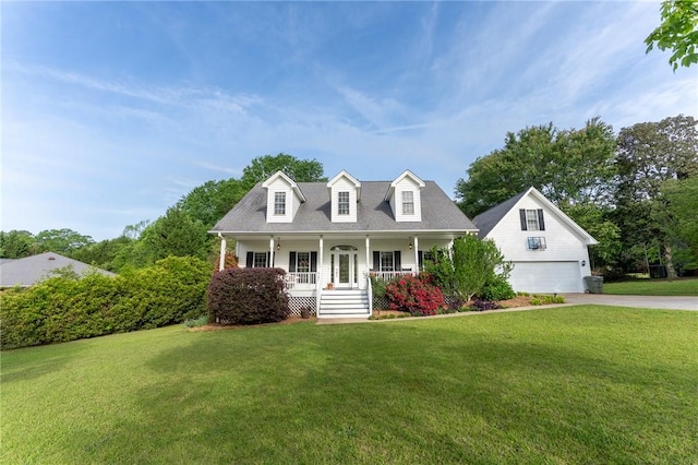 cape cod-style house with driveway, a front lawn, and covered porch