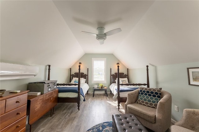 bedroom featuring lofted ceiling, a ceiling fan, wood finished floors, and baseboards