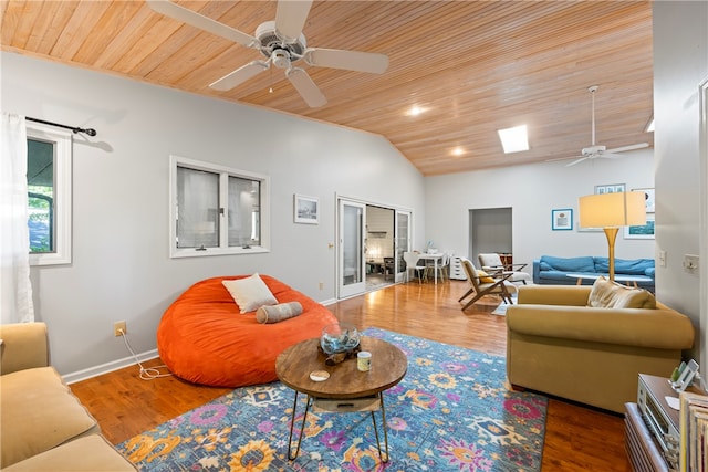 living room with wood ceiling, vaulted ceiling, wood finished floors, and ceiling fan