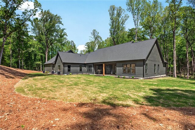 back of house with a yard