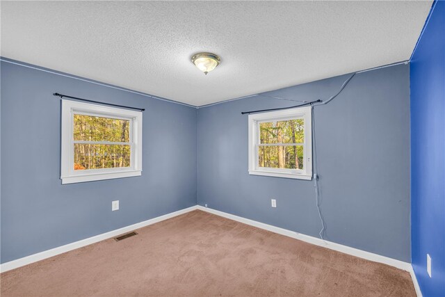 105 Bonner Rd, Mountain Rest, SC 29664 - unfurnished room with baseboards, visible vents, a textured ceiling, and carpet