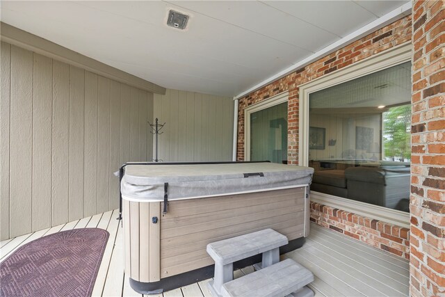 deck with a hot tub