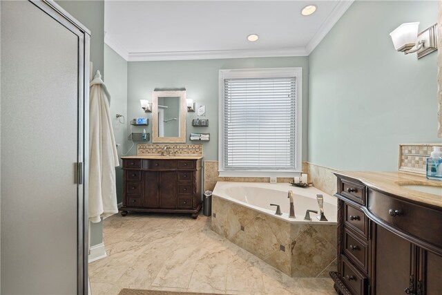 bathroom featuring recessed lighting, a sink, a bath, two vanities, and ornamental molding