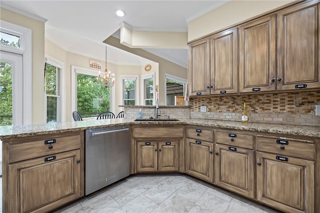 kitchen featuring stainless steel dishwasher, brown cabinetry, a sink, and a chandelier