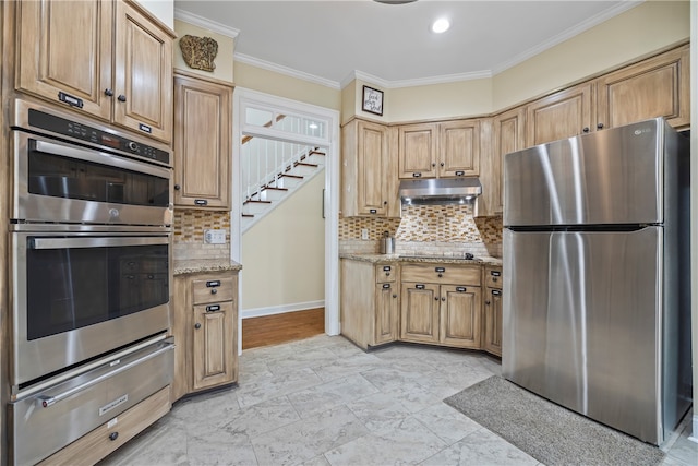 kitchen featuring tasteful backsplash, appliances with stainless steel finishes, under cabinet range hood, ornamental molding, and a warming drawer