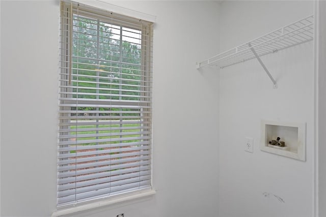 clothes washing area with hookup for a washing machine and laundry area