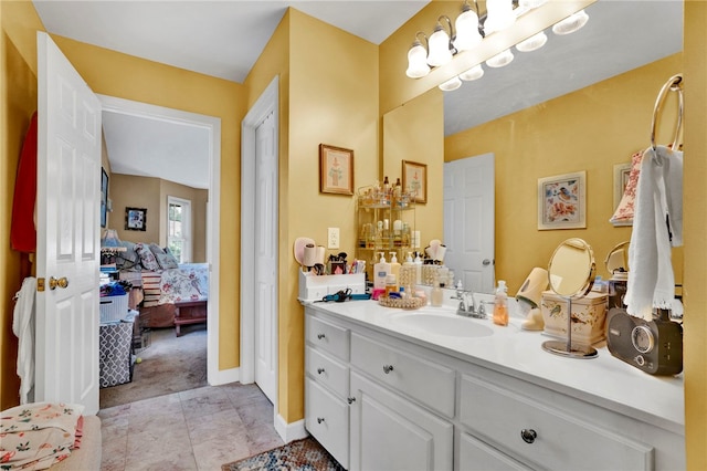ensuite bathroom featuring ensuite bathroom and vanity