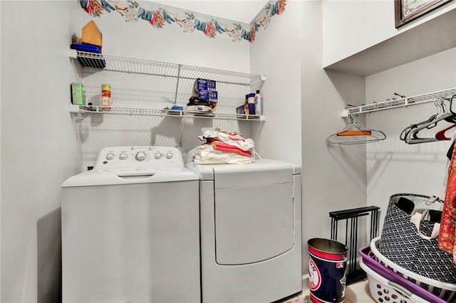 clothes washing area featuring laundry area and independent washer and dryer