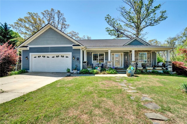 craftsman-style home with a porch, a front yard, driveway, and a garage