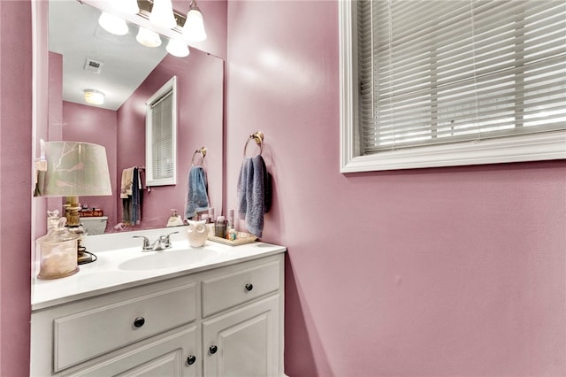 bathroom with visible vents and vanity