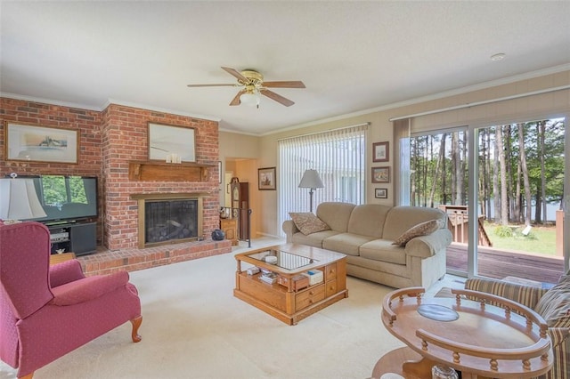 living room with light colored carpet, ceiling fan, ornamental molding, and a brick fireplace