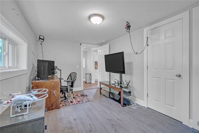 office featuring wood finished floors and baseboards