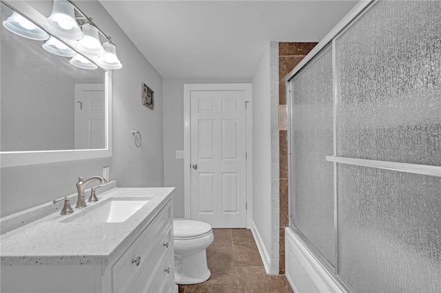 bathroom with an enclosed shower, toilet, tile patterned flooring, and vanity