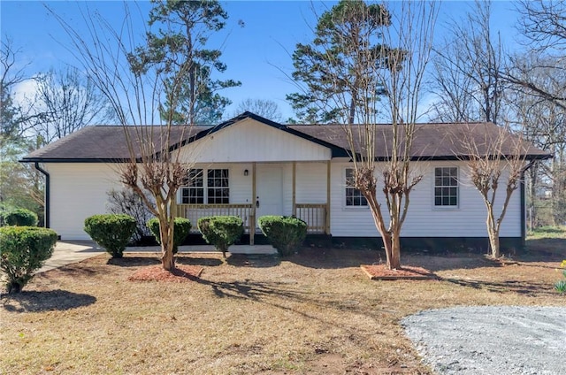ranch-style home featuring a porch
