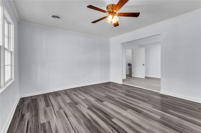 unfurnished room featuring dark wood finished floors, visible vents, ceiling fan, and baseboards