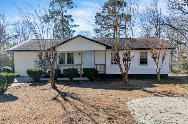 ranch-style home featuring covered porch