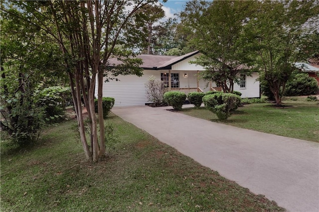 1004 Gilreath Rd, Anderson, SC 29621 - view of front facade with covered porch, concrete driveway, a front lawn, and a garage