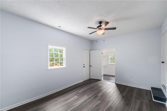 1004 Gilreath Rd, Anderson, SC 29621 - unfurnished bedroom with dark wood finished floors, baseboards, a textured ceiling, and a ceiling fan