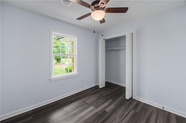 1004 Gilreath Rd, Anderson, SC 29621 - unfurnished bedroom with dark wood finished floors, baseboards, a closet, and a ceiling fan