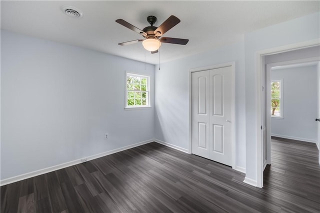 1004 Gilreath Rd, Anderson, SC 29621 - unfurnished bedroom featuring dark wood finished floors, baseboards, a closet, and ceiling fan